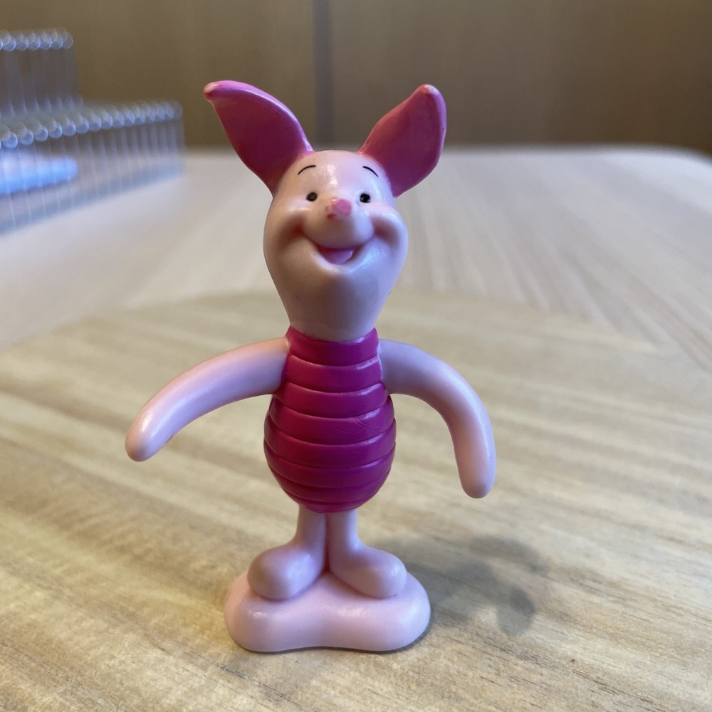 Piglet PVC figurine, likely a vintage Disney collectible 'damaged'